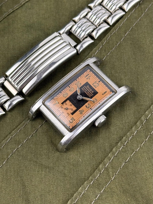 1940s Doxa Clamshell Copper Tuxedo Dial